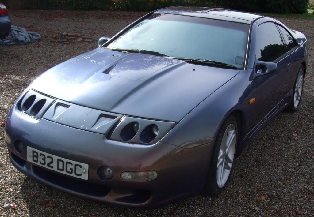 a glossy dark blue classic car