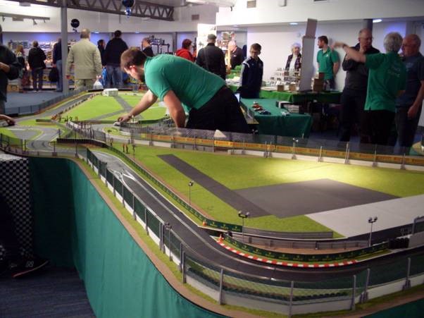 a busy slot car market with track laid out