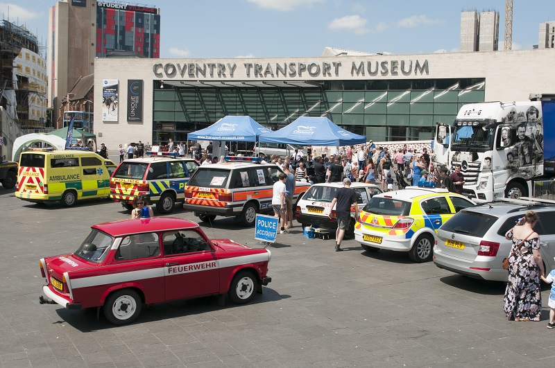 crowds outside the museum looking at emergency vehicles