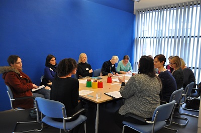 a group of people working at a table